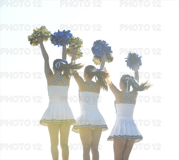 Caucasian cheerleaders posing together