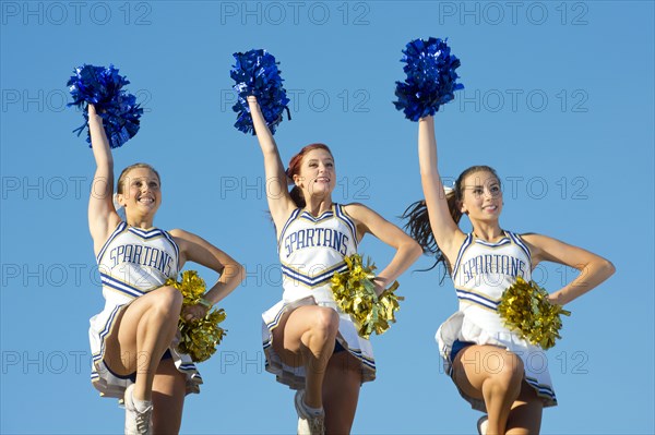 Caucasian cheerleaders posing together