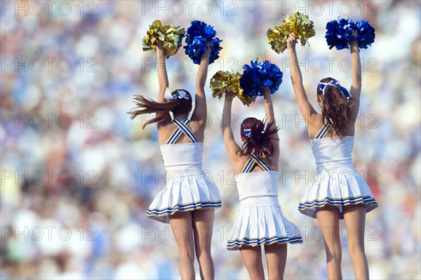 Caucasian cheerleaders posing together