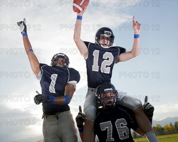 Football players cheering in game