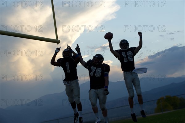 Football players cheering in game