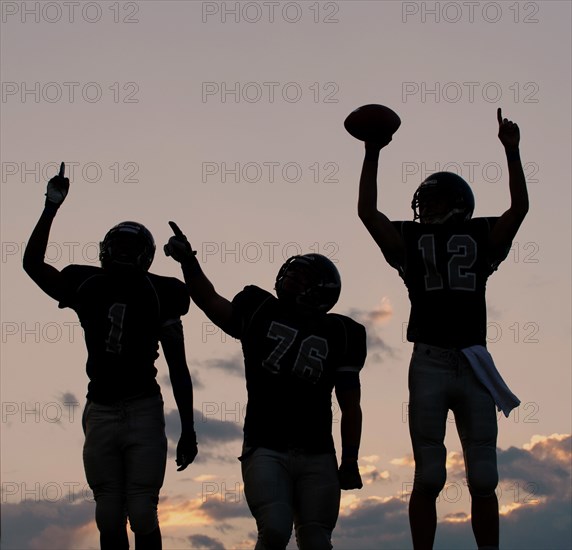 Football players cheering in game