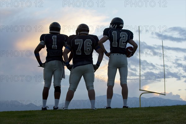 Football players standing on field