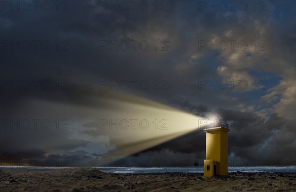 Lighthouse overlooking rocky landscape