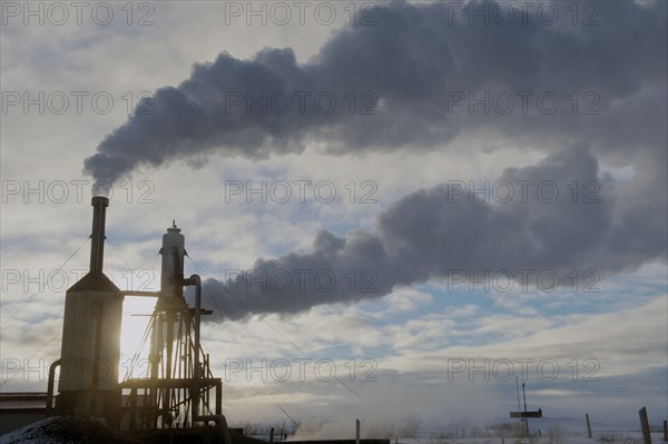 Steam billowing from power plant smoke stacks