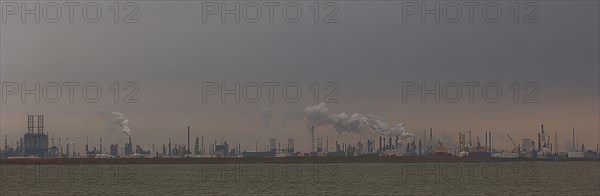 Smoke billowing from distant factory