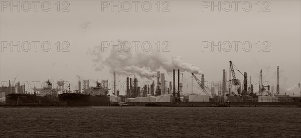 Smoke billowing from distant factory