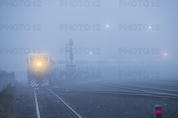 Train light in foggy station