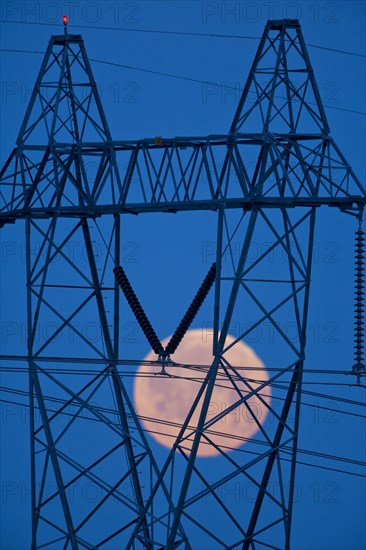 Moon viewed through power lines