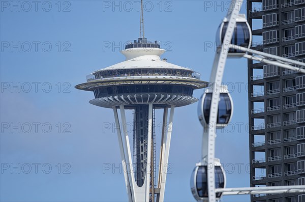 Space Needle overlooking Ferris wheel