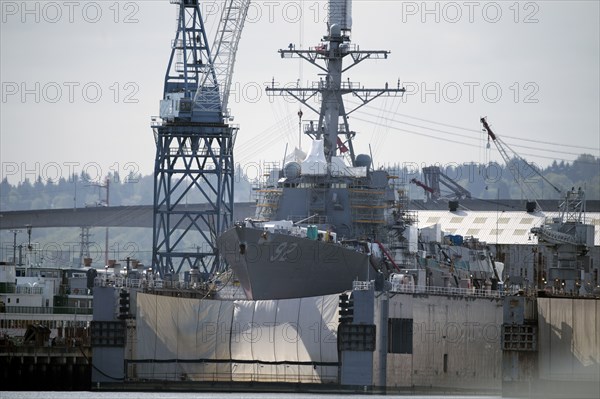 Shipping cranes and ship in industrial harbor