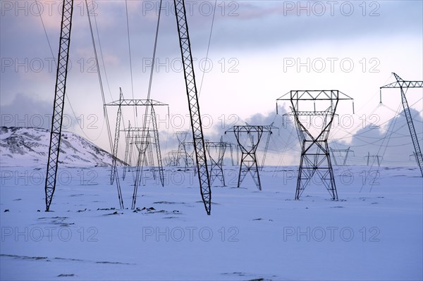 Power lines in snowy landscape