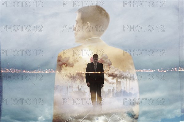 Double exposure of businessman and urban coastline