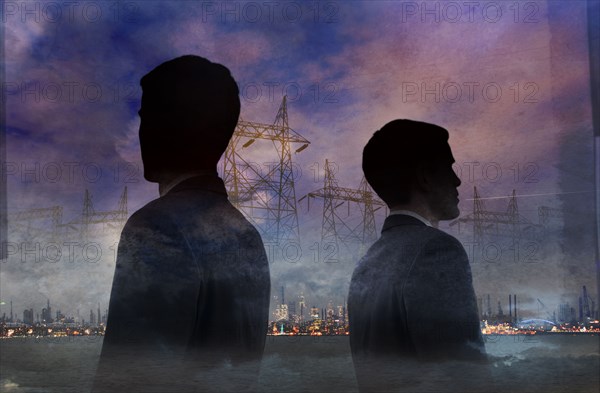 Double exposure of businessmen and power lines