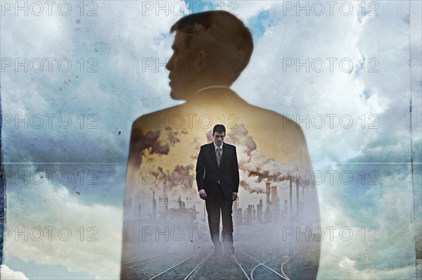 Double exposure of businessman in clouds