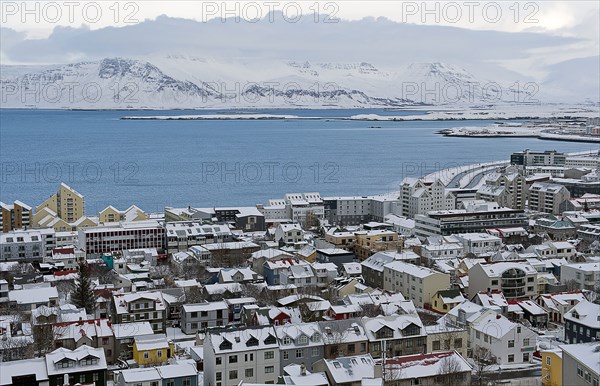 Aerial view of snowy city in rural landscape