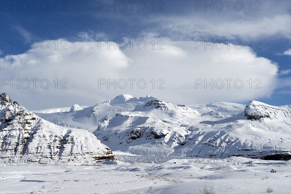 Snow covered mountain in rural landscape