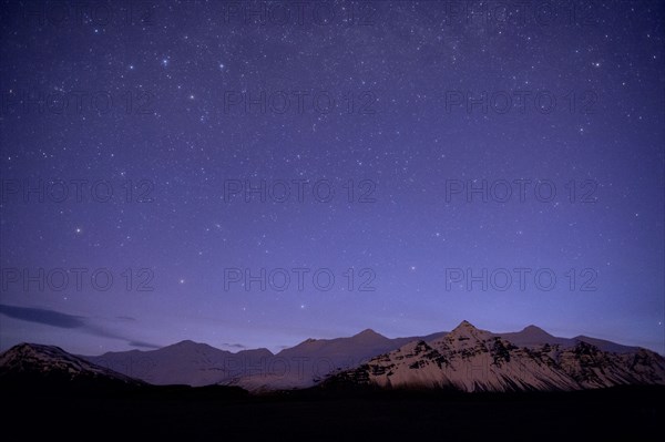 Starry sky over arctic landscape