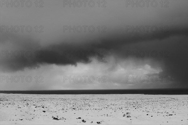 Cloudy sky over arctic landscape