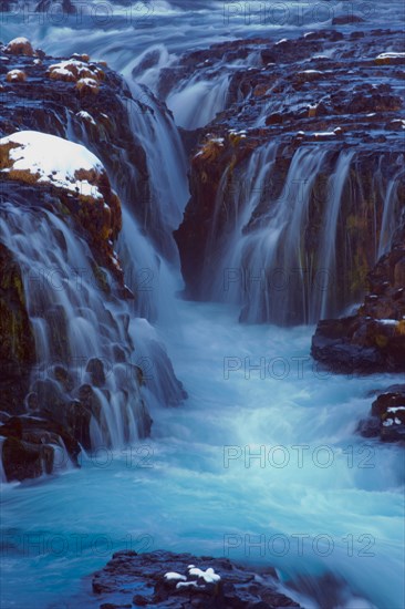 Waterfall flowing over cliff