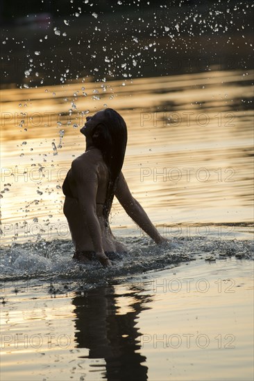 Korean woman playing in lake