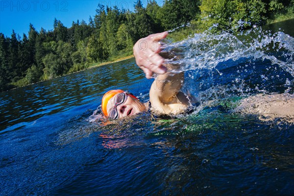 Woman swimming in lake