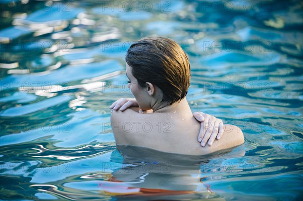 Woman swimming in lake