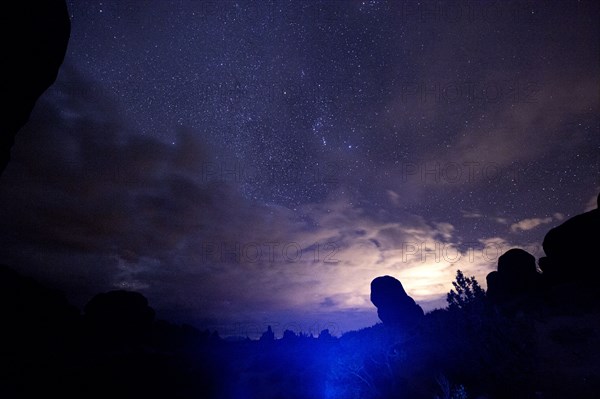 Illuminated rocks at night in Arches National Park