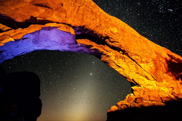 Illuminated rocks at night in Arches National Park