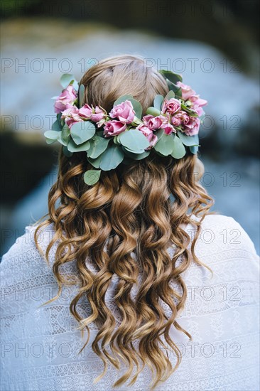 Caucasian woman wearing flower crown