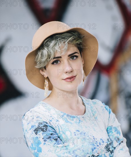 Caucasian woman at graffiti wall