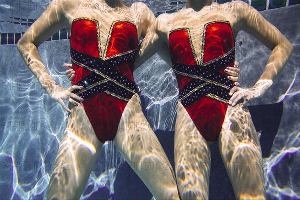 Portrait of synchronized swimmers underwater