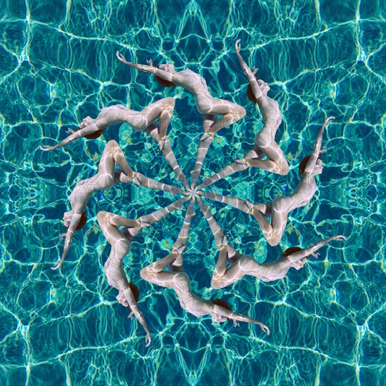 Multiple exposure of Caucasian woman swimming in spiral