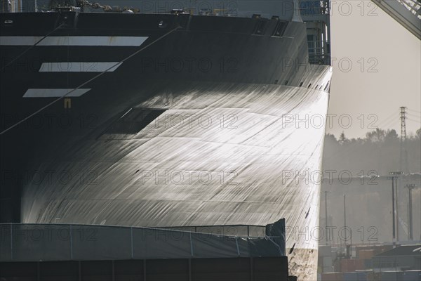 Hull of ship at shipping port