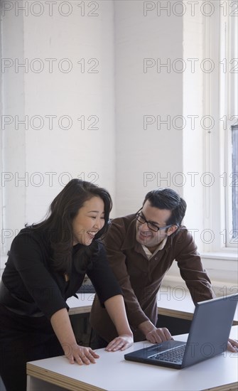 Multi-ethnic businesspeople laughing