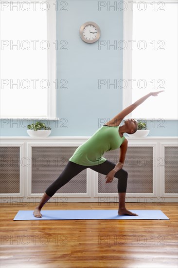 Black woman practicing yoga