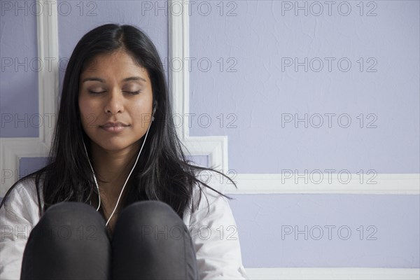 Sri Lankan woman listening to mp3 player
