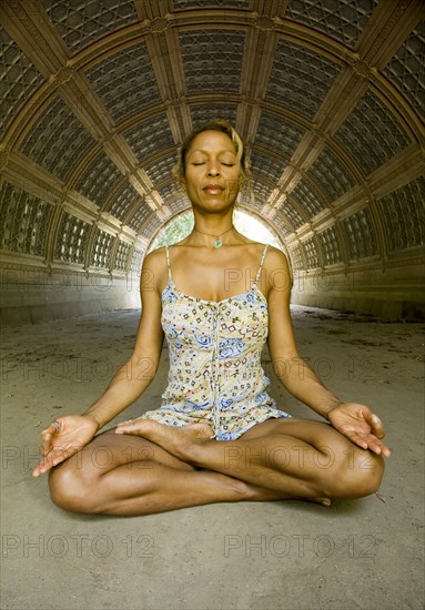 Mixed race woman practicing yoga