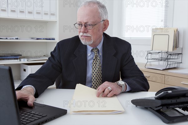 Caucasian businessman working in office