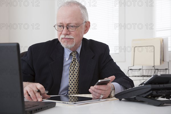 Caucasian businessman working in office