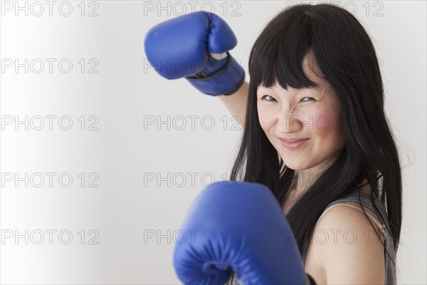 Chinese boxer with raised fists