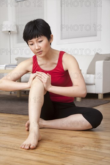 Woman stretching in living room