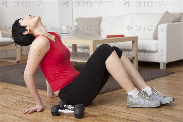 Woman laughing in living room