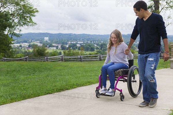 Couple holding hands in park