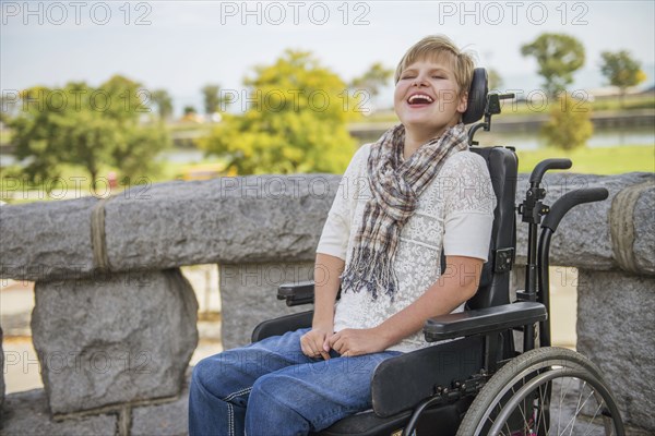 Paraplegic woman laughing in wheelchair