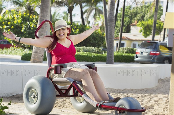 Paraplegic woman in wheelchair in park