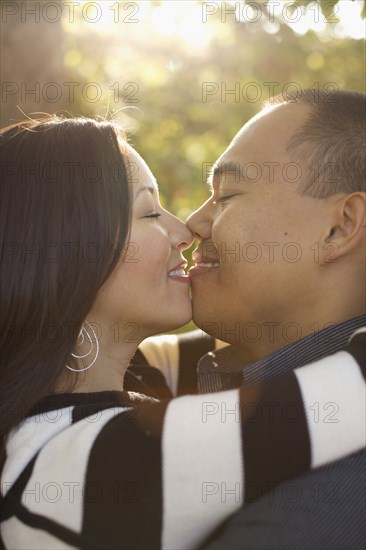 Couple kissing outdoors