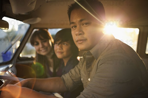 Family riding in van together