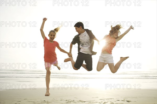 Friends playing on beach