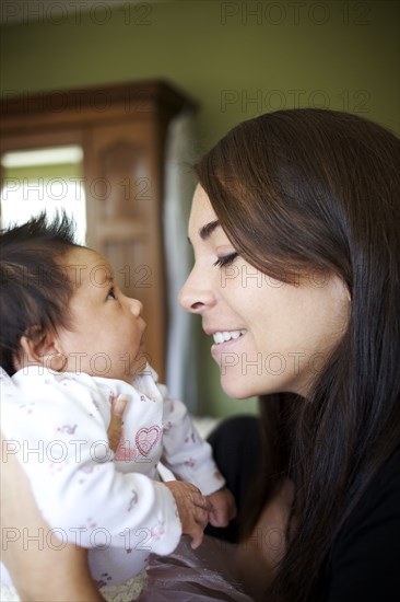 Mother looking at newborn baby